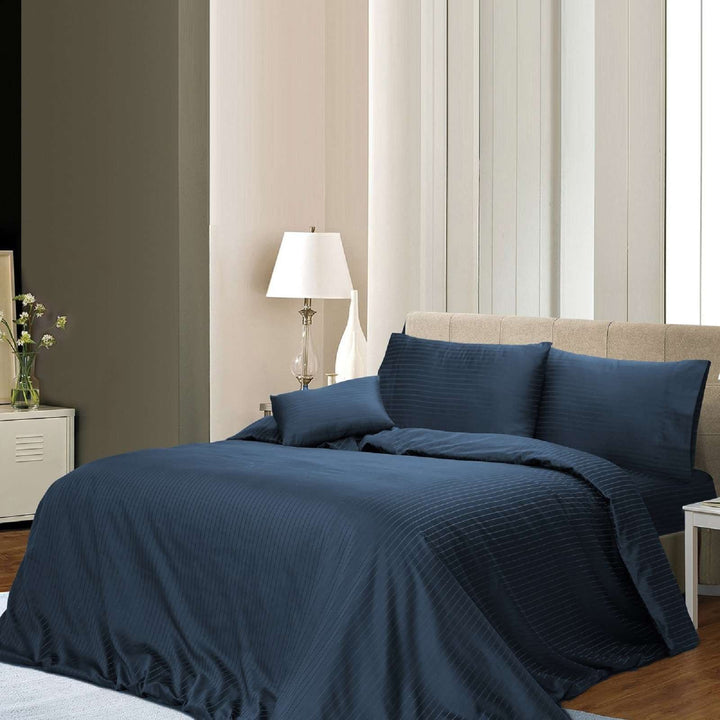 1000TC 6-piece navy blue cotton rich stripe quilt cover set styled on a queen bed