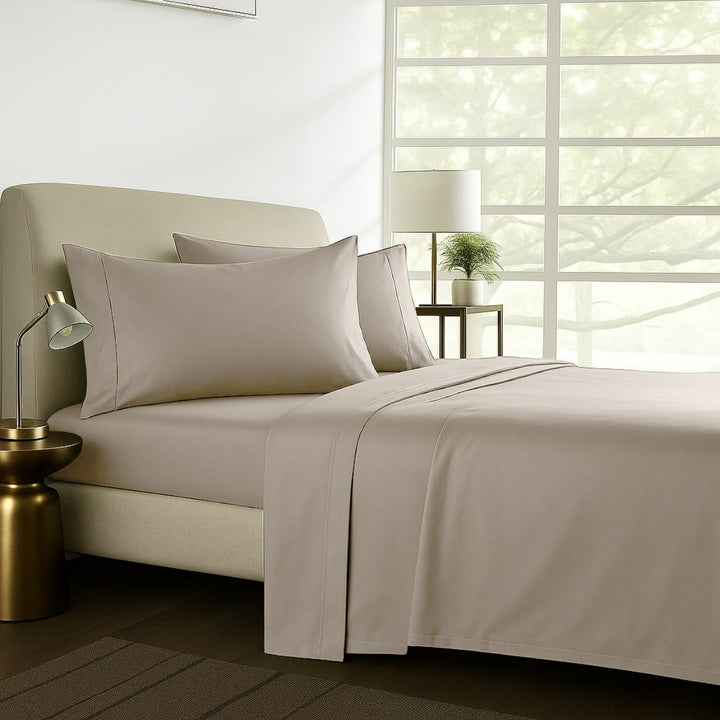 1000TC pure soft cotton sheet set styled on a bed in a warm-toned bedroom