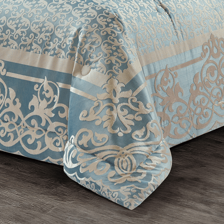 Luxury 10-piece silver blue bedding set with intricate damask designs and decorative matching cushions.