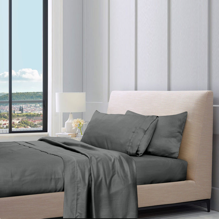 1200TC pure cotton sheet set in charcoal on a bed with pillows, styled bedroom setting