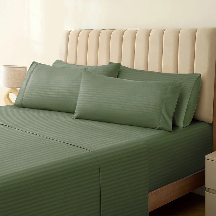 1500TC cotton rich sage green striped sheet set neatly styled on a bed with matching pillowcases