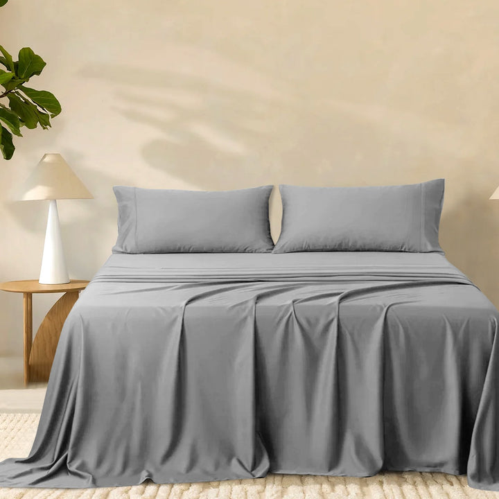 2000TC super soft bamboo sheet set in charcoal grey styled on a bed with two matching pillowcases