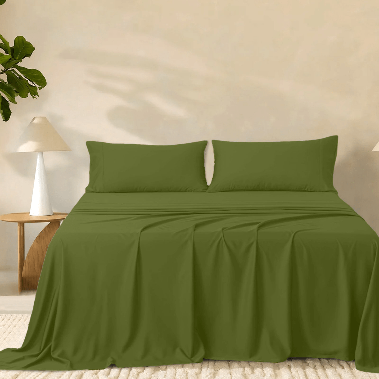 2000TC super soft bamboo sheet set in rich olive green styled on a bed with two matching pillowcases