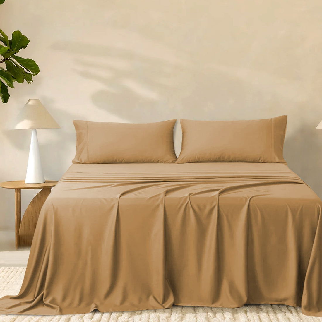2000TC super soft bamboo sheet set in warm taupe styled on a bed with two matching pillowcases