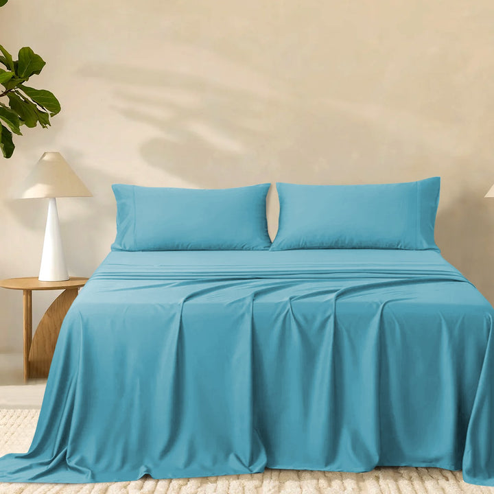 2000TC super soft bamboo sheet set in vibrant teal styled on a made bed with matching pillowcases