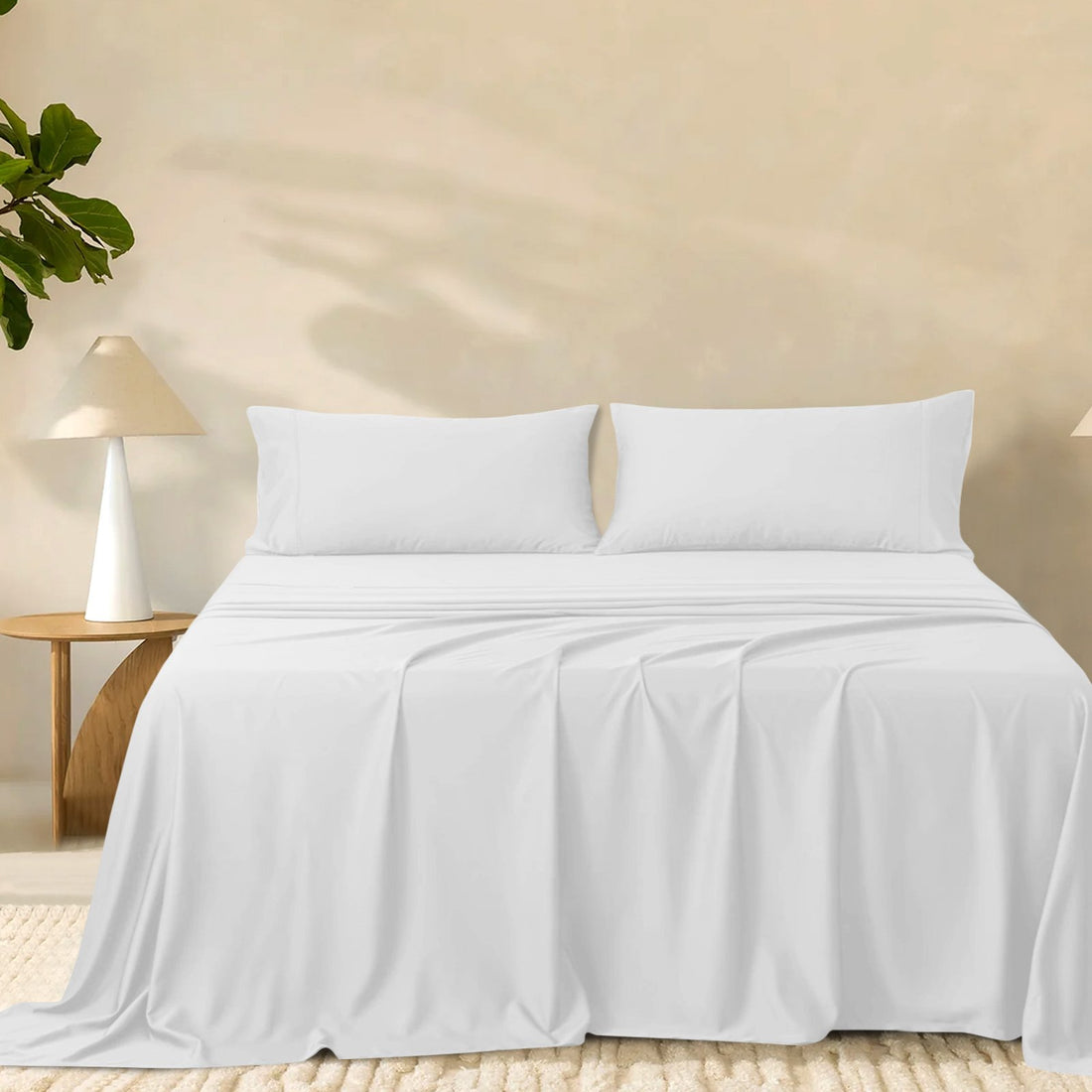 2000TC super soft bamboo sheet set in crisp white styled on a made bed with two matching pillowcases