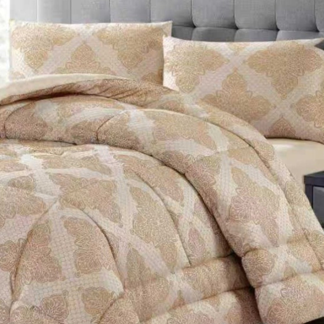 Full view of light brown quilted jacquard comforter with matching pillows in a modern bedroom.
