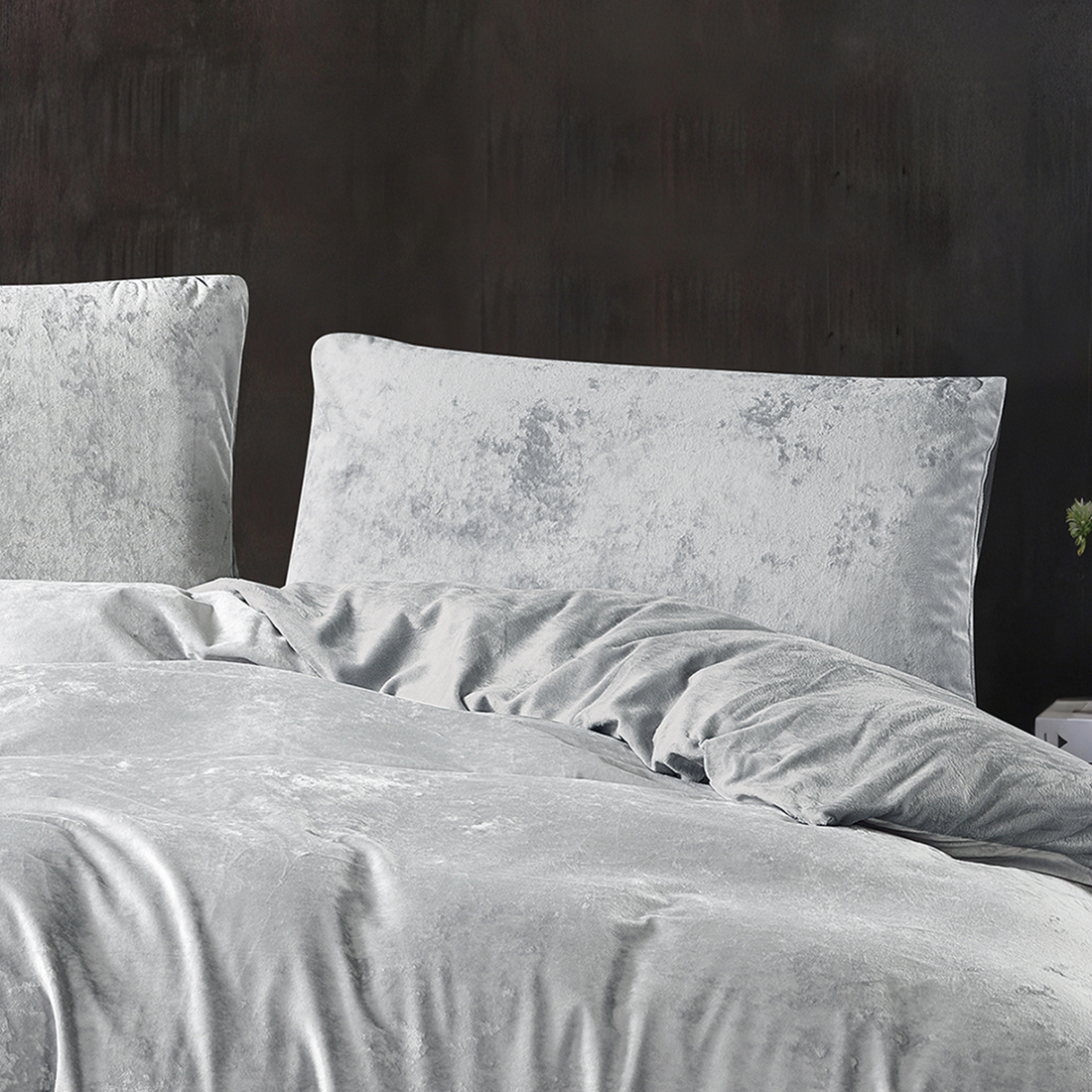 Soft silver velvet quilt cover with matching pillowcases.