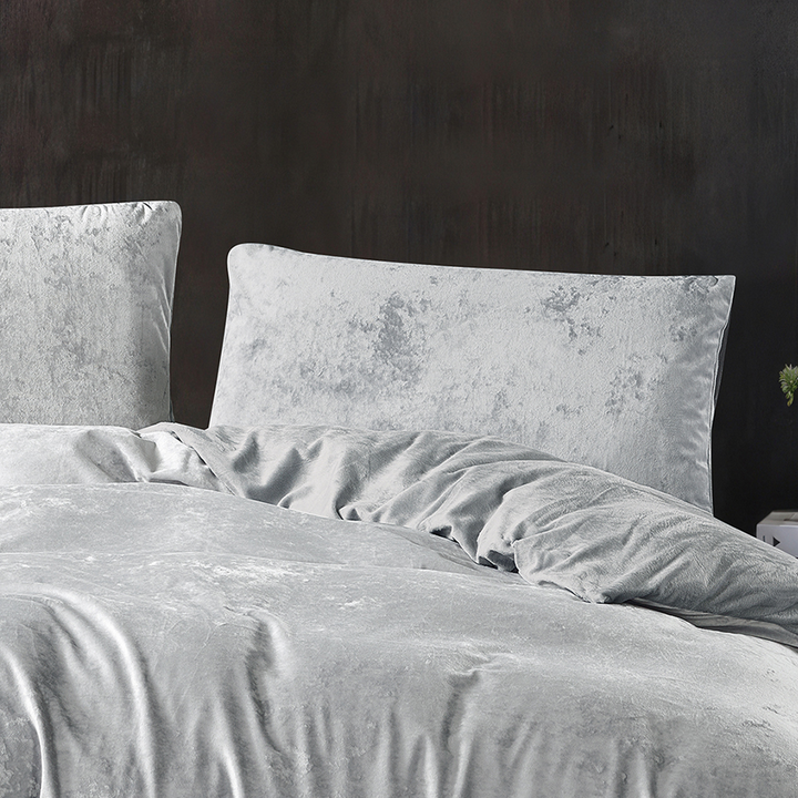 Soft silver velvet quilt cover with matching pillowcases.