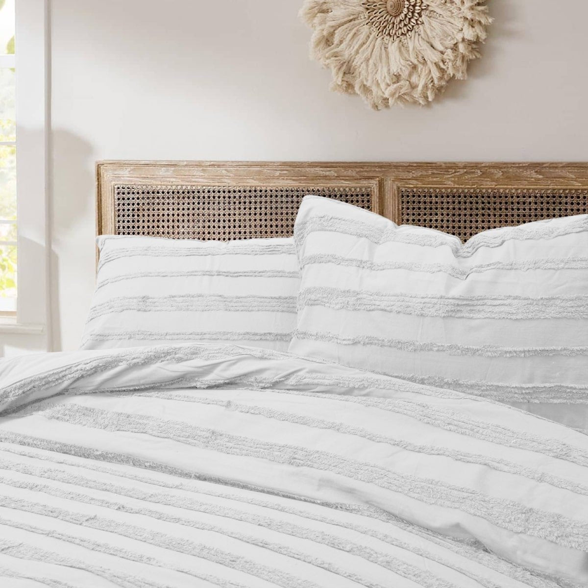 Textured white quilt cover with matching pillowcases.