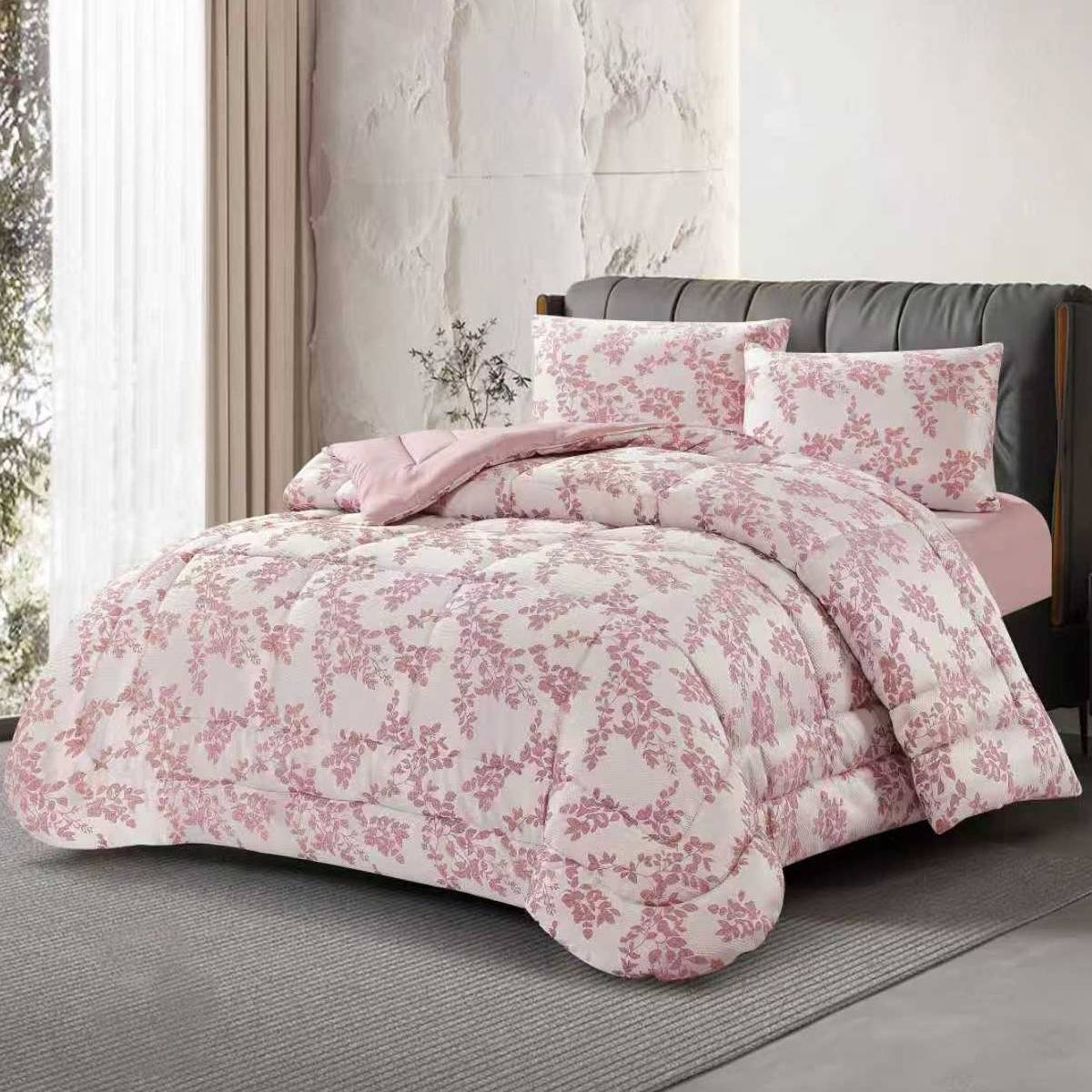3-piece pink jacquard comforter set with delicate floral patterns styled neatly on a bed