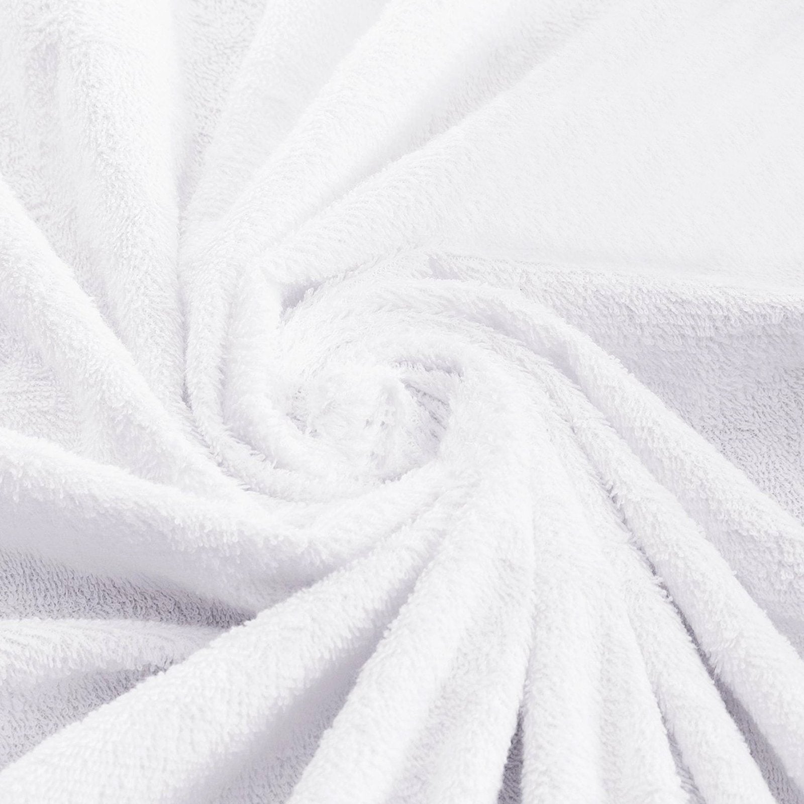 Close-up perspective of the deep elastic skirt of a white terry toweling mattress protector on a bed