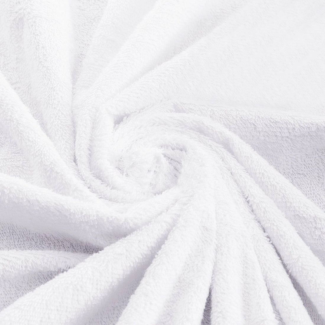 Close-up perspective of the deep elastic skirt of a white terry toweling mattress protector on a bed