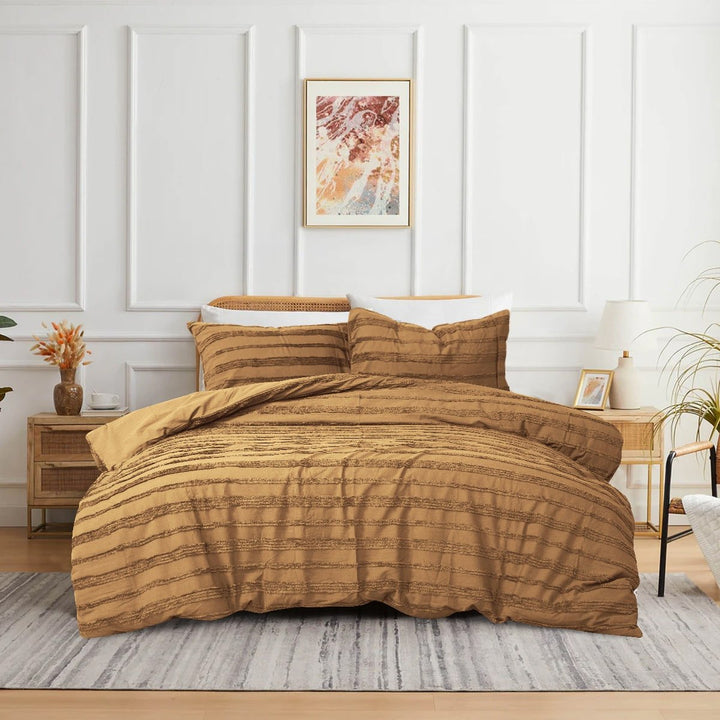 Camel 3-piece tufted quilt cover set displayed on a modern bed.