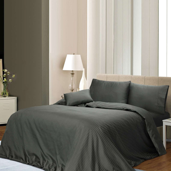 Charcoal 3-piece cotton pin stripe quilt cover set styled on a modern bed.