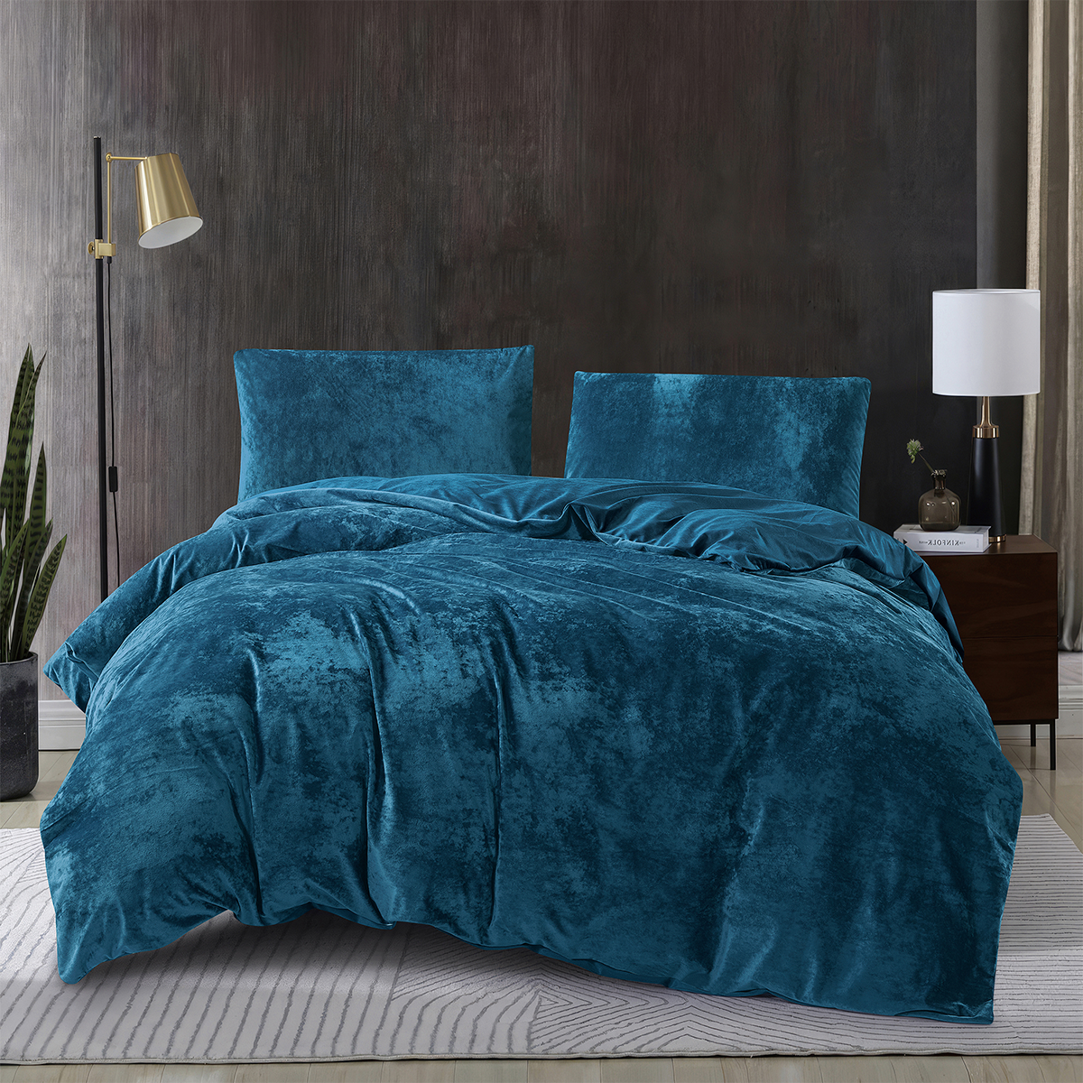 Dark teal blue 3-piece crushed velvet quilt cover set displayed on a modern bed.