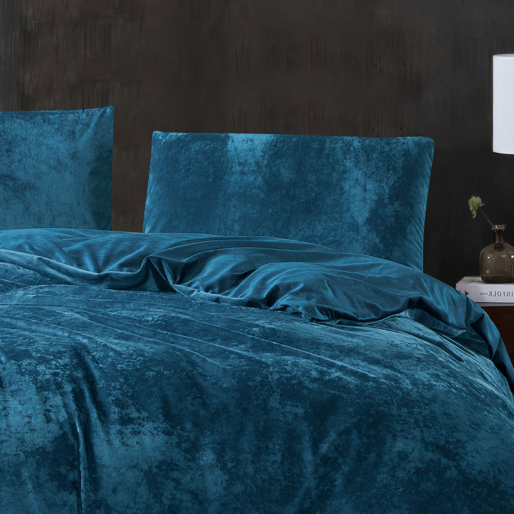 Soft dark teal velvet quilt cover with matching pillowcases.
