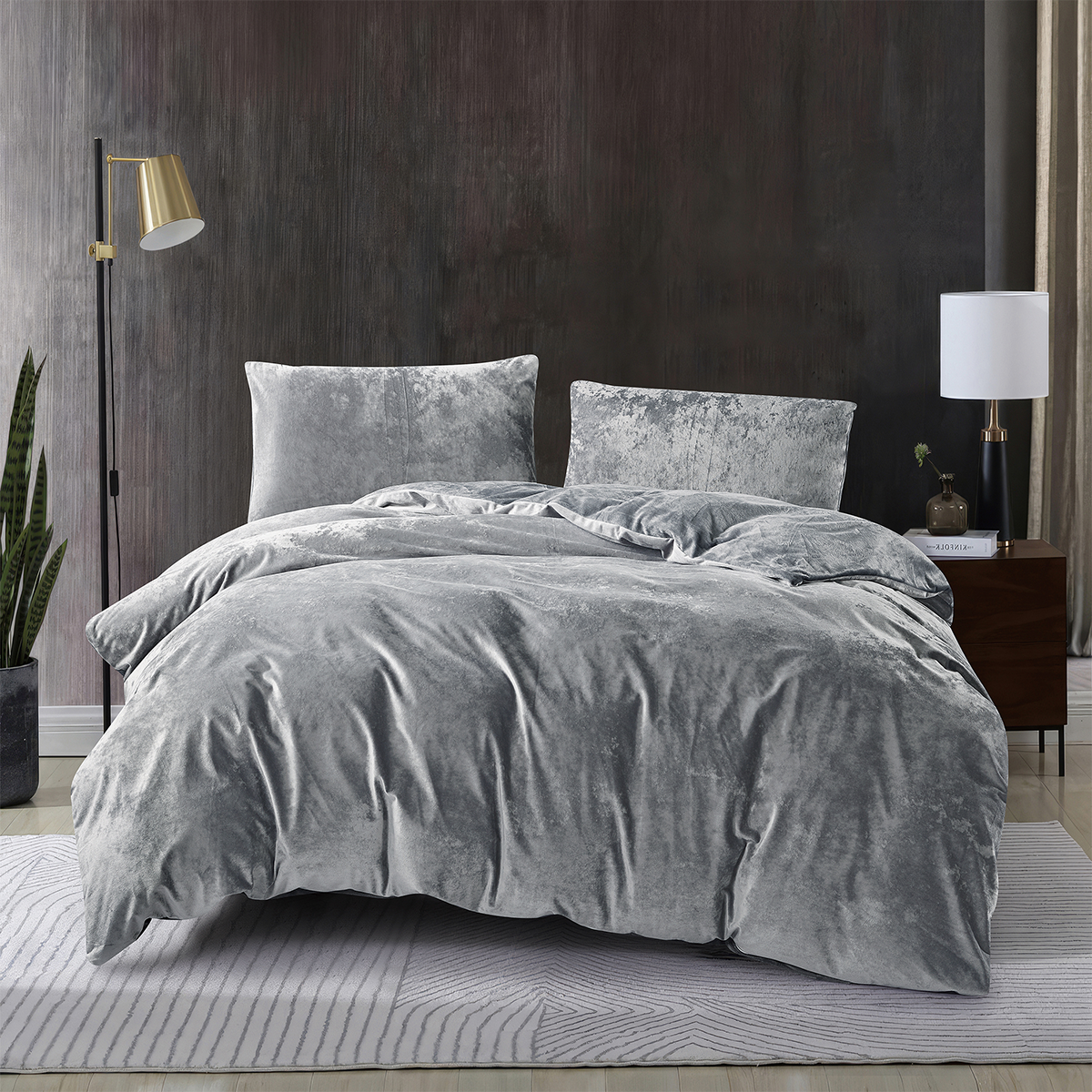 Grey 3-piece crushed velvet quilt cover set displayed on a modern bed.