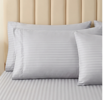 Front-facing view of a silver gray striped pillowcase layered over matching damask stripe bed sheets.