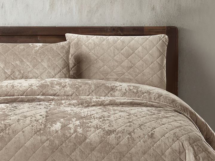 Premium beige velvet bedspread featuring a diamond quilted pattern.