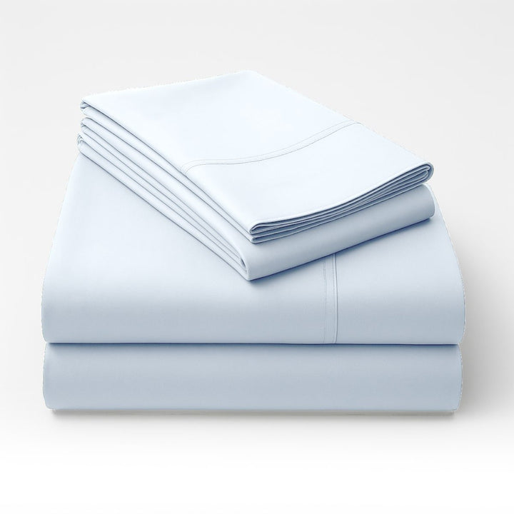 Folded blue cotton sheets stacked neatly