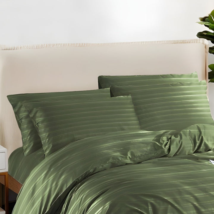 Sage green cotton quilt cover featuring elegant textures in a cozy bedroom