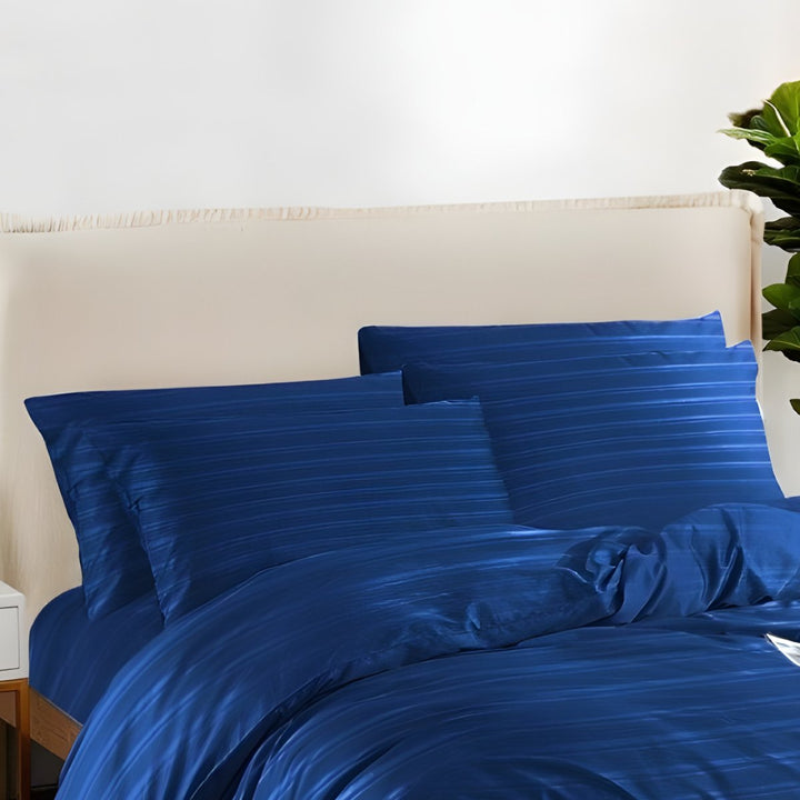 Navy blue cotton quilt cover featuring an elegant textured design in a cozy bedroom.