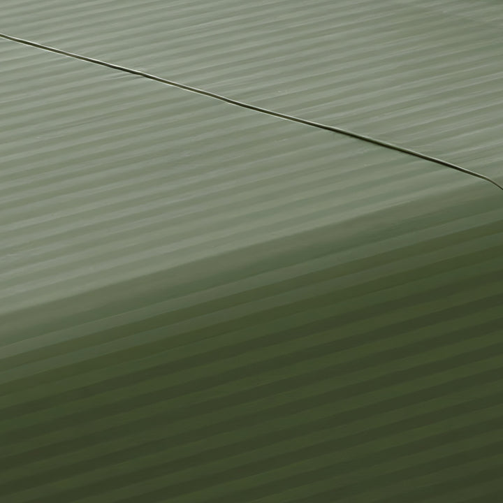 Close-up perspective of the smooth satin stripe weave on a sage green cotton rich fitted sheet.
