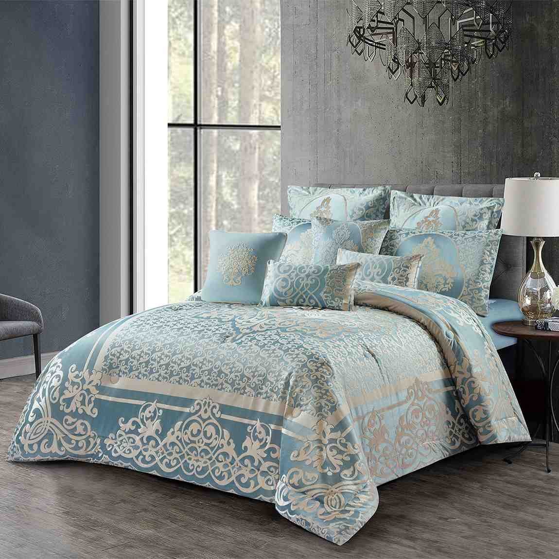 Silver blue damask bedding gift set featuring an elegant floral pattern and matching pillows on a luxury bed.