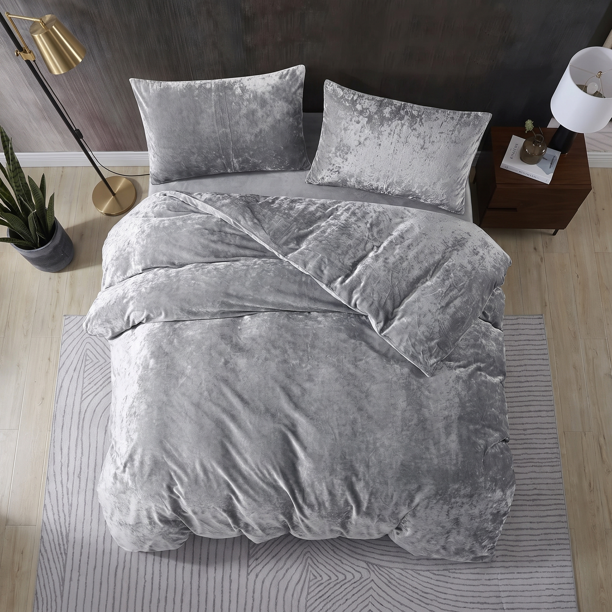 Grey crushed velvet bedding set with matching cushions and a luxurious finish.