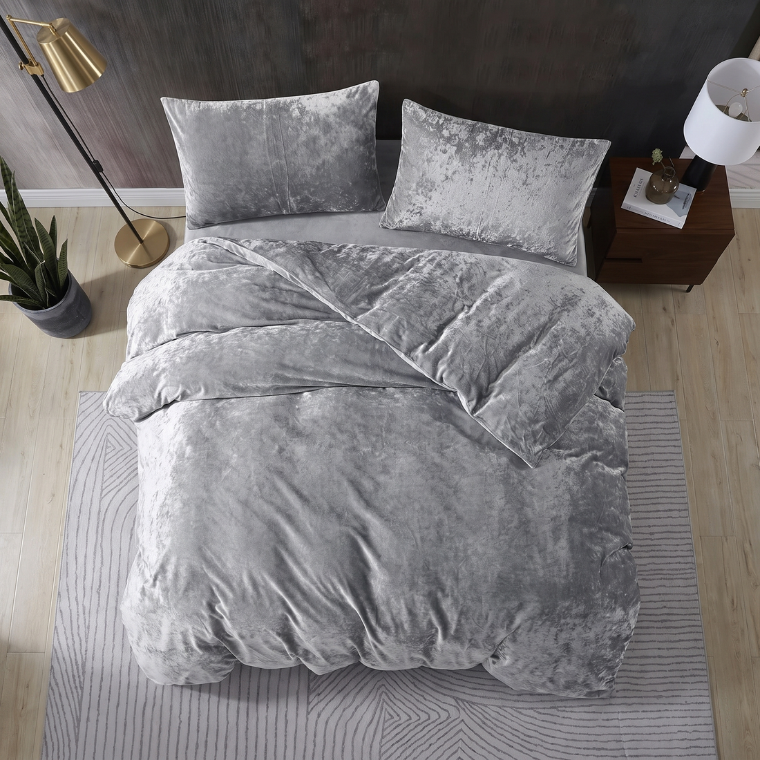 Grey crushed velvet bedding set with matching cushions and a luxurious finish.
