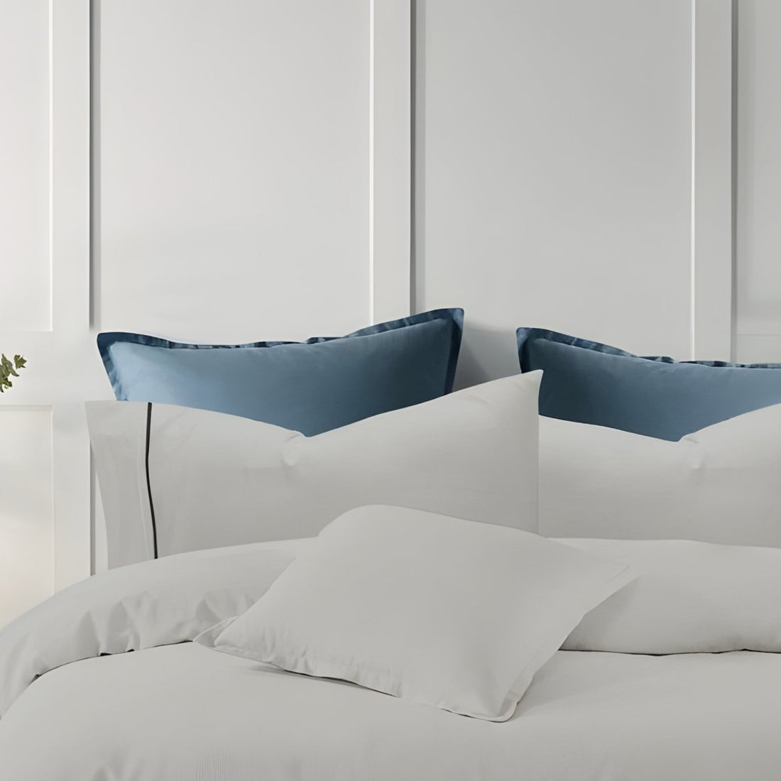 Soft silver bedding featuring a stylish embroidered border design.