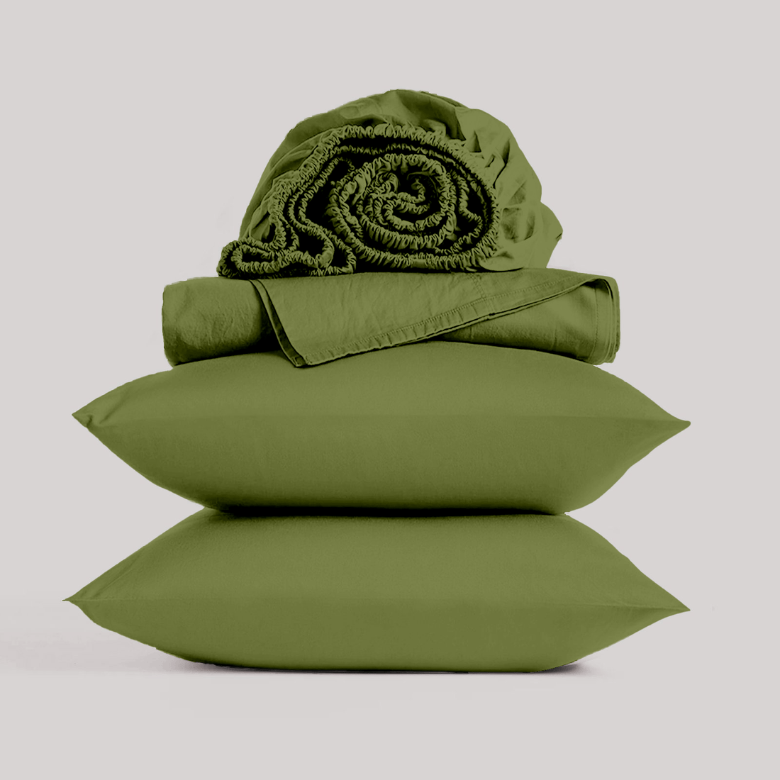 Stacked olive green bamboo pillowcases topped with a rolled bamboo sheet set isolated on a plain studio background