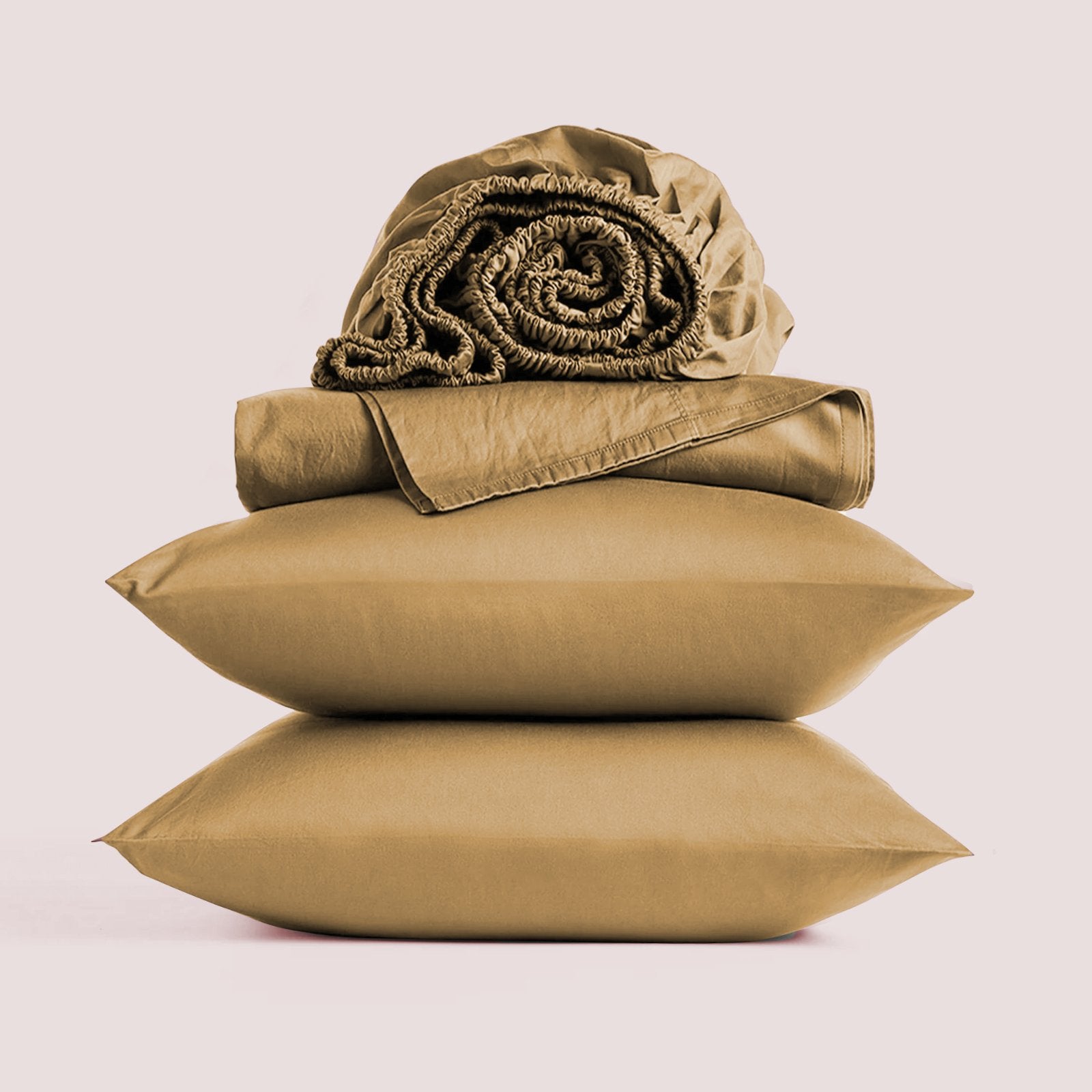 Stacked taupe bamboo pillowcases topped with a rolled bamboo sheet set isolated on a plain background