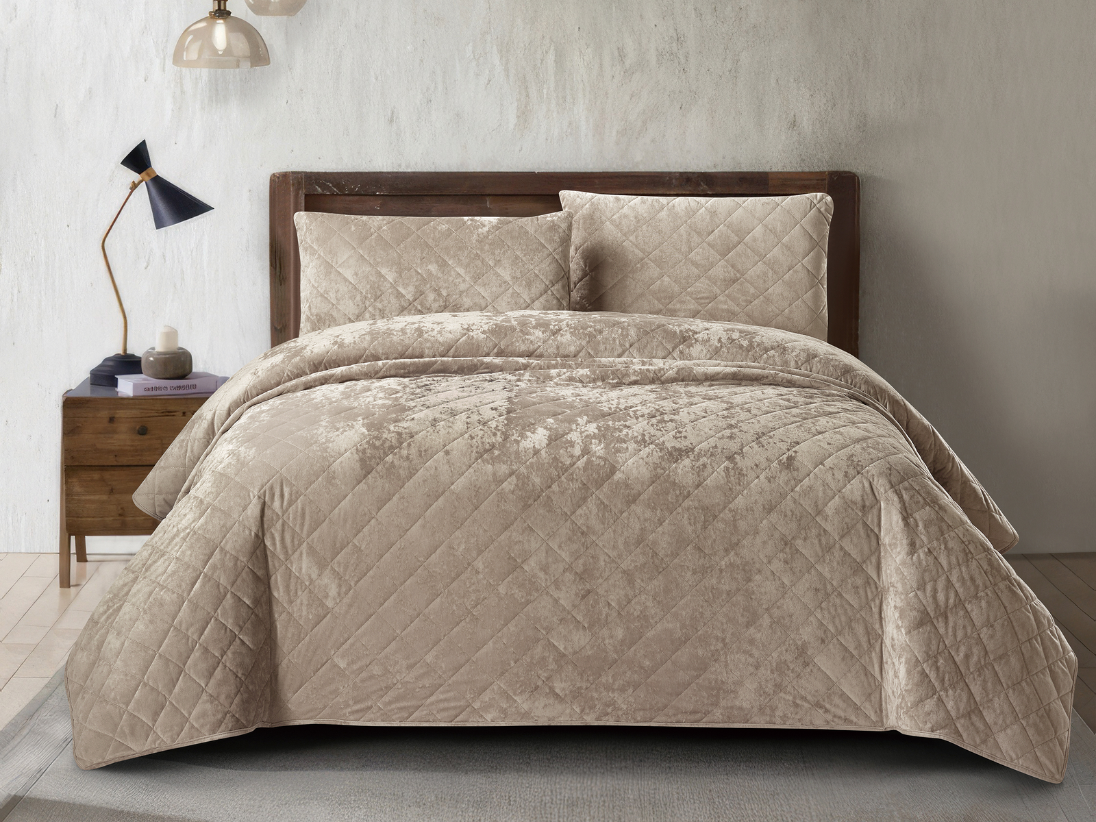Luxury tan crushed velvet bedspread set styled on an elegant bedroom bed.