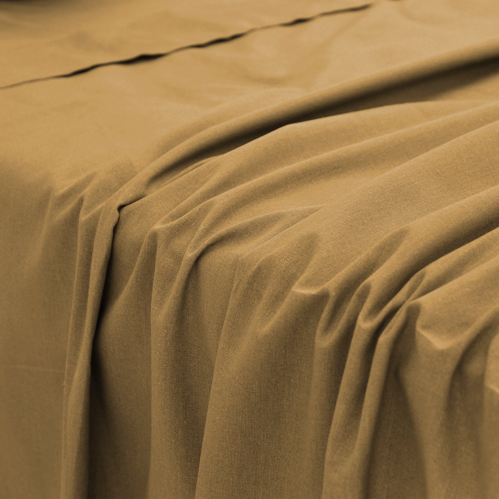 Close-up perspective of the smooth fabric folds and silky drape of a taupe bamboo bed sheet