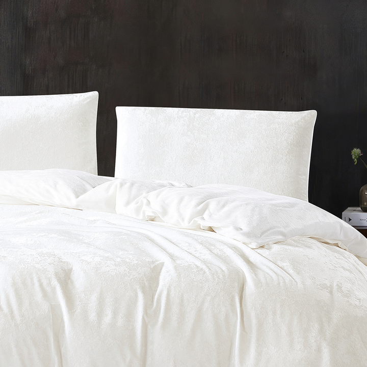 Soft white velvet quilt cover with matching pillowcases.