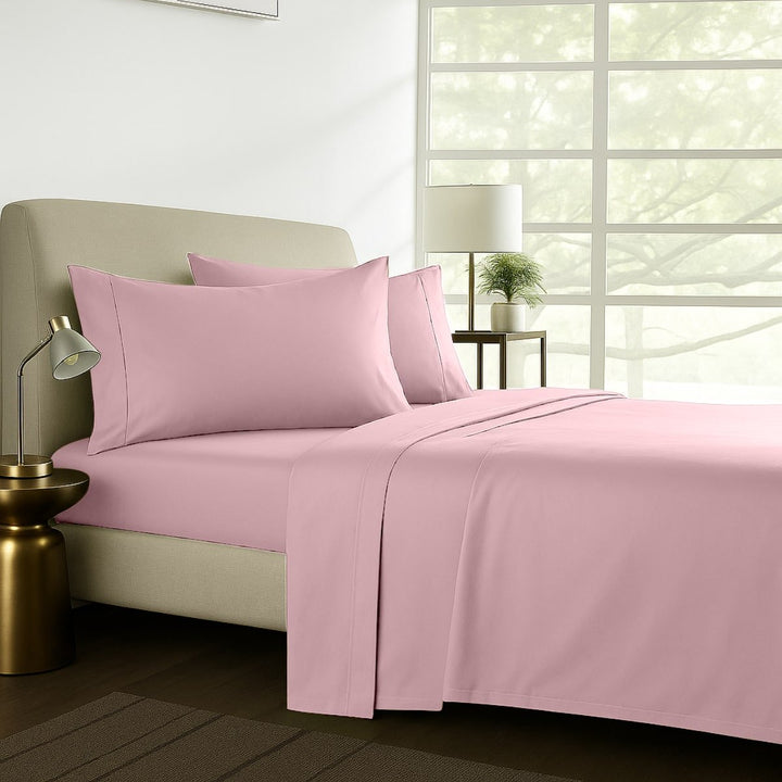 Baby pink cotton sheet set styled