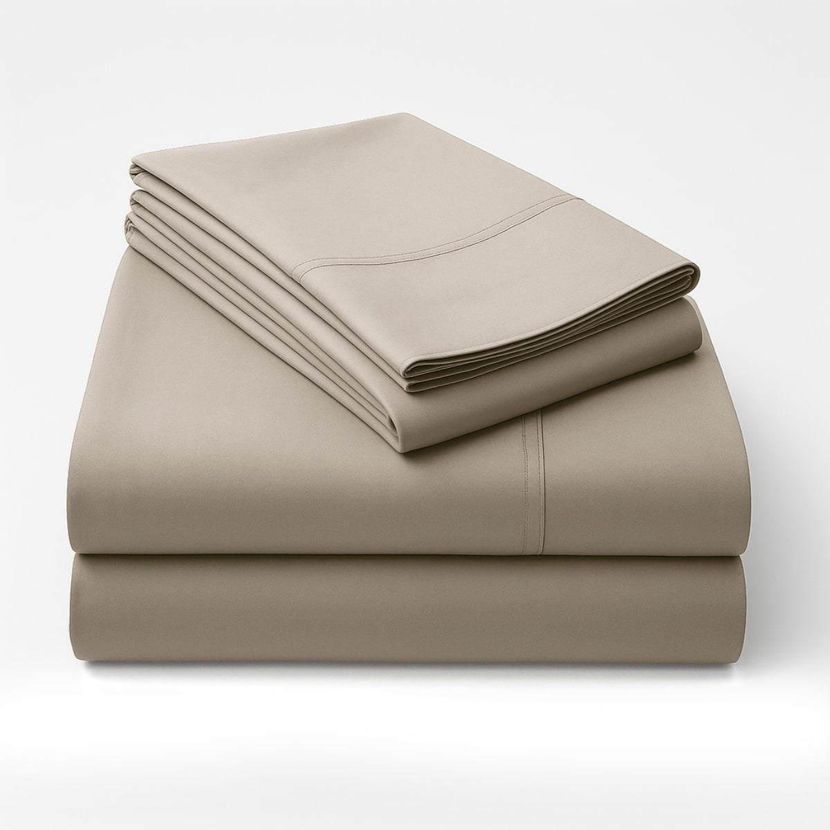 Folded beige cotton sheet set stacked showing fabric sheen and softness