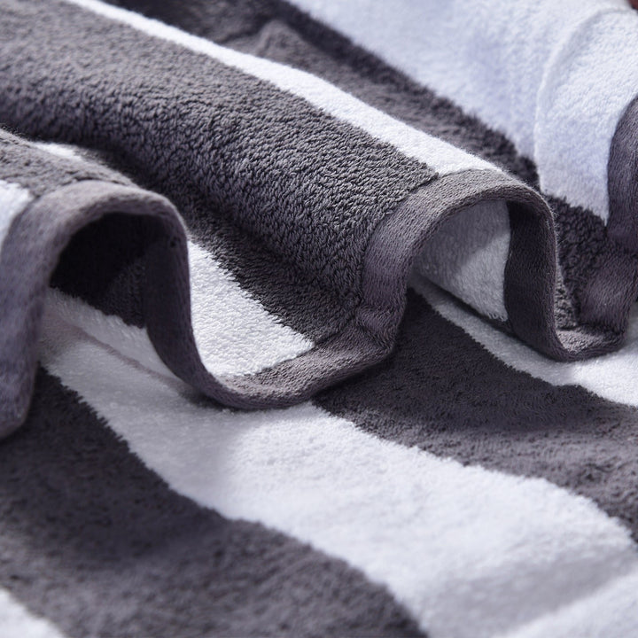 Charcoal white towel hanging on rod