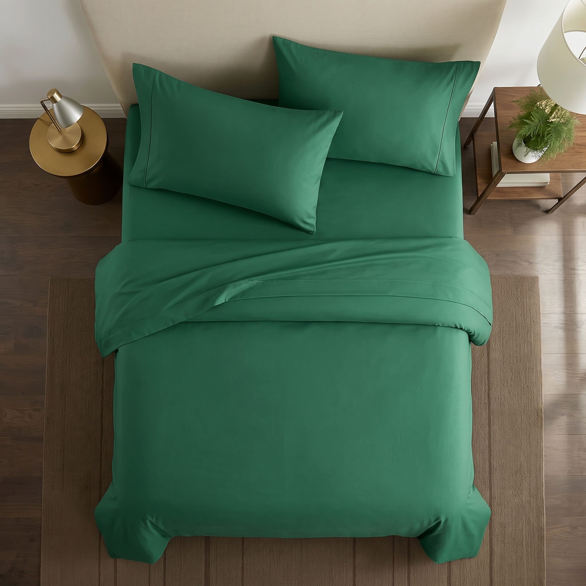 Close-up of dark green pillowcases showing soft cotton weave and stitched edge