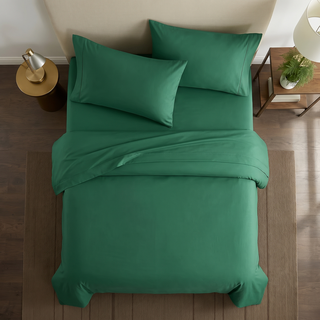 Close-up of dark green pillowcases showing soft cotton weave and stitched edge