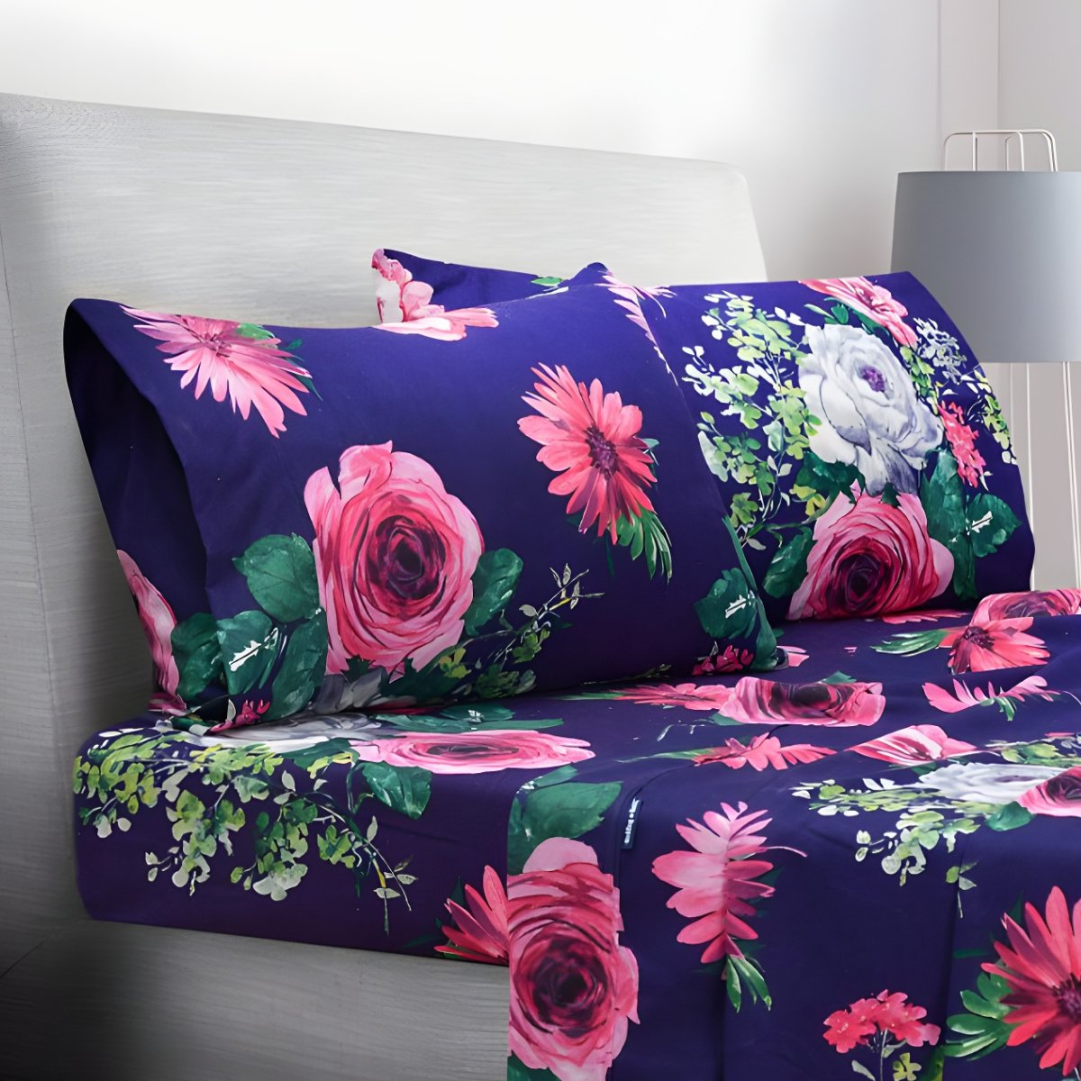 Folded navy floral sheets stacked neatly