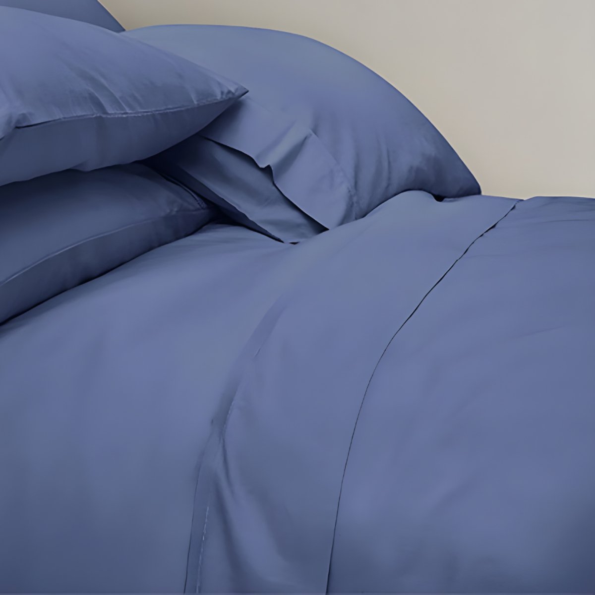 Blue bed sheets with grey headboard