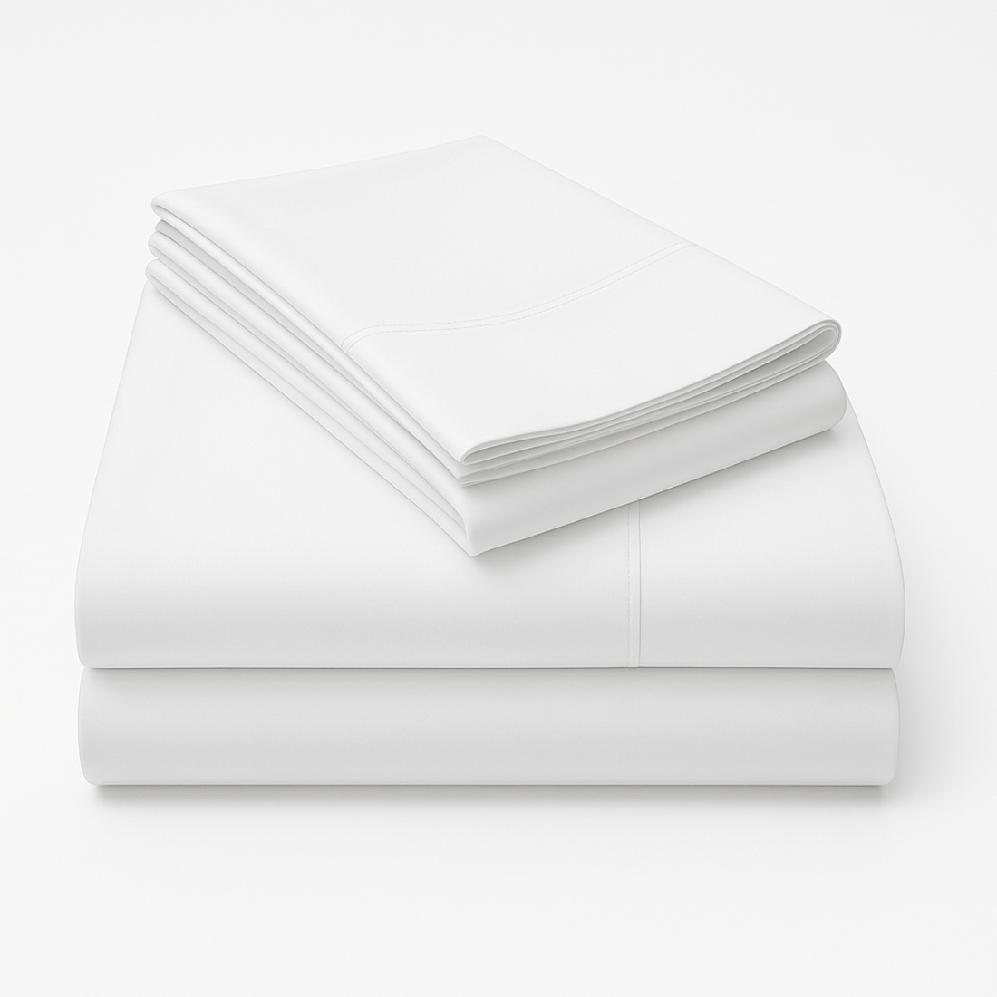 Folded white cotton sheet set stacked showing crisp fabric texture