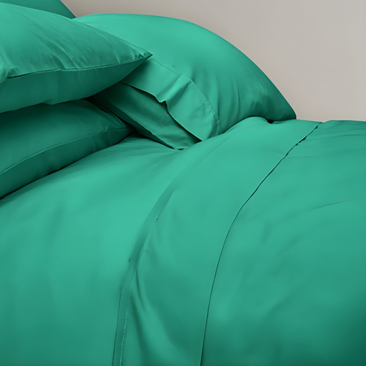 Green bed sheets with grey headboard