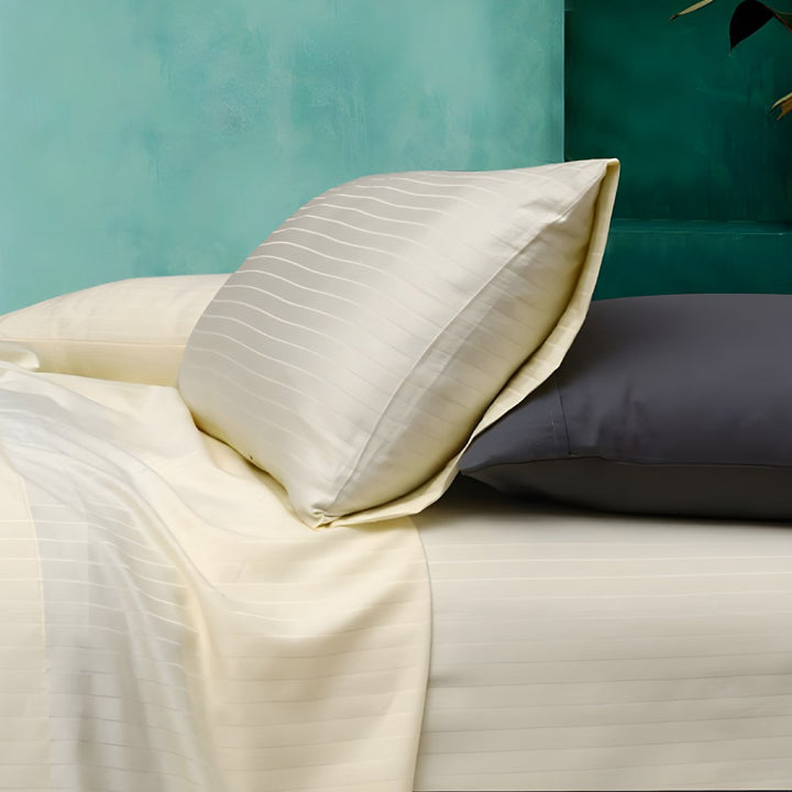 Ivory striped sheets with grey pillows