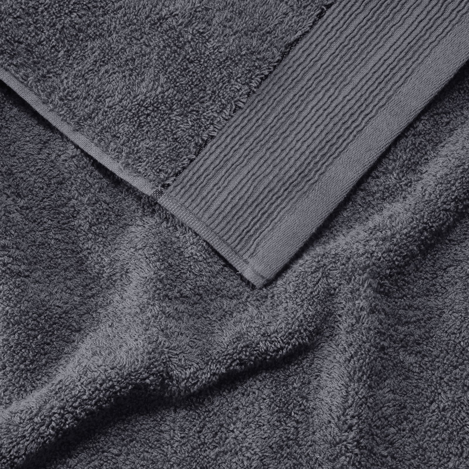 Stacked grey towels folded neatly
