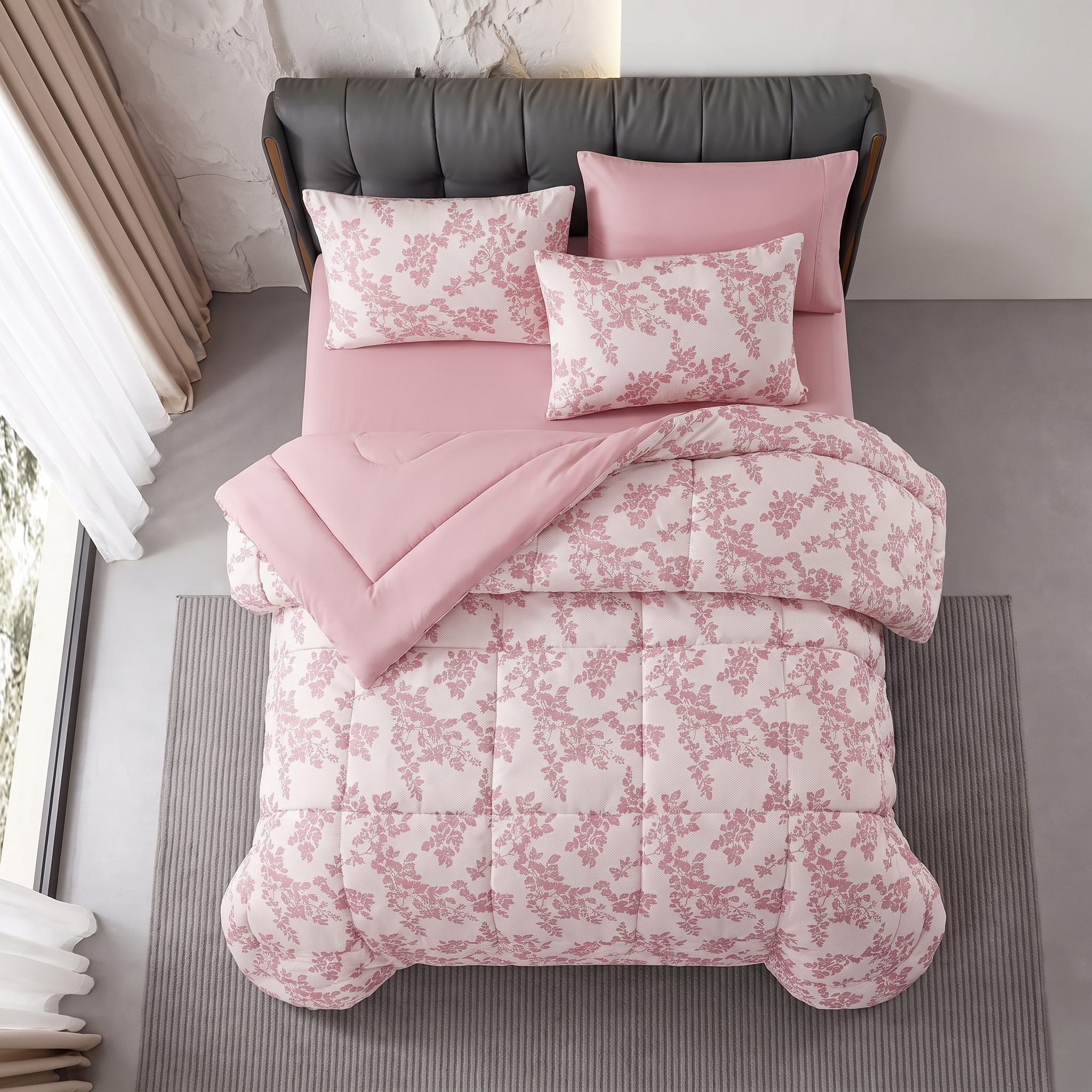 Modern grey tufted headboard paired with a soft pink floral jacquard comforter and pillowcases