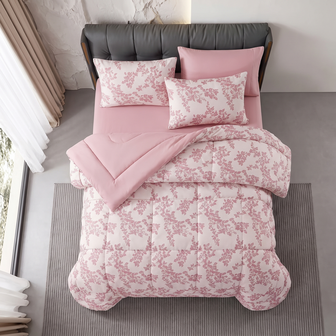 Modern grey tufted headboard paired with a soft pink floral jacquard comforter and pillowcases